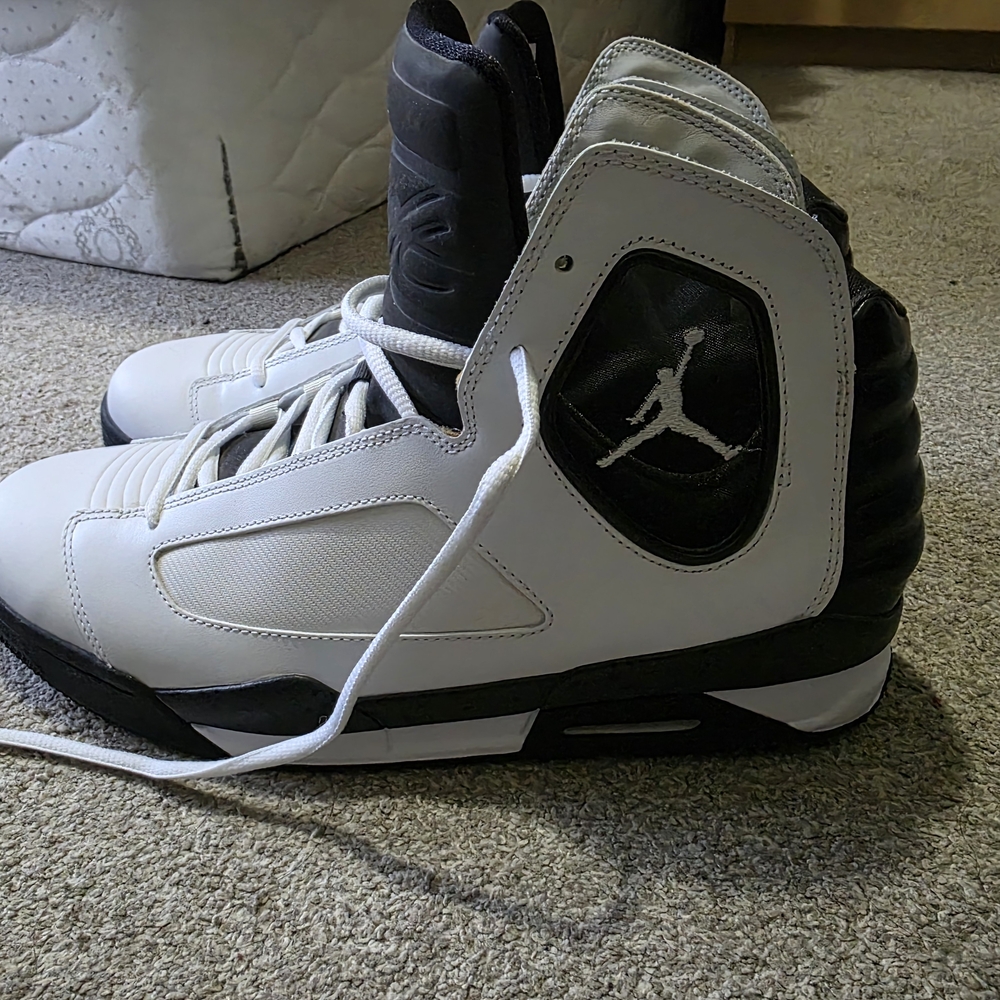Nike Air Jordan Flight Luminary basketball shoes in white and black.
